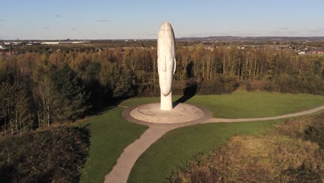 The-Dream-sculpture-Bold-forest-landmark-face-obelisk-statue-aerial-view-St-Helens-slow-rising-forward