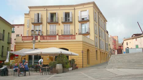 Customers-In-A-Cafeteria-In-The-Old-Town-Of-Castelló-d'Empúries-In-Alt-Emporda,-Girona,-Spain