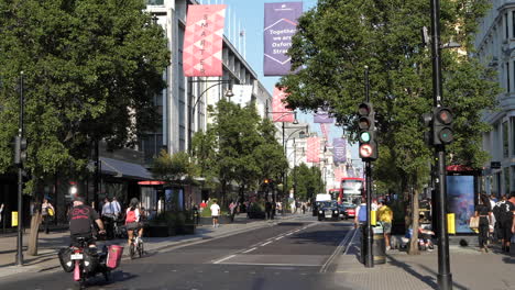 Steady-shot-of-traffic-on-a-summer-day,-famous-Oxford-Street-in-London-city