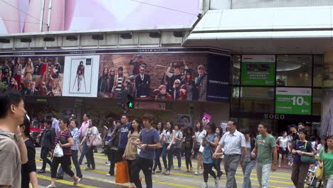 People-Crossing-In-The-Road-In-Front-Of-SOGO-Department-Store-In-Causeway-Bay