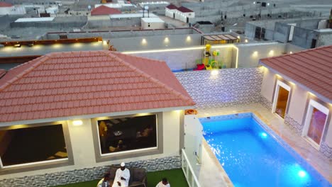 Men-drinking-tea-in-leisure-area-of-newly-built-house