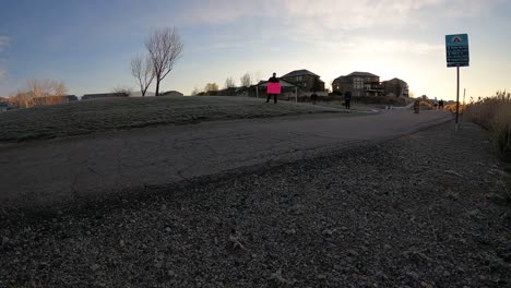 Low-angle-view-of-people-running-in-a-half-marathon-on-Thanksgiving-holiday