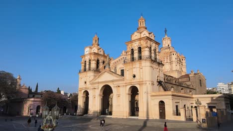 Aerial-slow-pedestal-down-shot-contemporary-block-letter-public-sign-displaying-A-MO-CBA,-I-LOVE-CORDOBA-at-the-front-of-Cathedral-of-Cordoba-at-downtown-San-Martin-Plaza