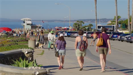 Caucasian-guy-skateboarding-down-the-street-in-La-Jolla,-California