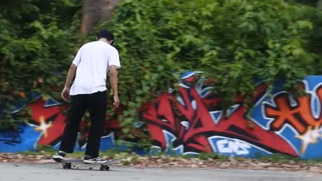 Boys-practice-skateboarding-in-an-abandoned-building-in-Denpasar,-Bali,-October-25,-2021