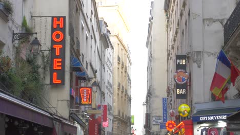 People-Walking-In-The-Street-With-Hotel,-Pub,-Restaurants-And-Souvenir-Shop-At-Latin-Quarter-In-Paris,-France