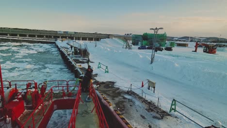 View-From-Deck-Of-Garinko-II-Drift-Ice-Cruise-Ship-Coming-Into-Dock-At-Pier-In-Monbetsu-With-Seaman-Looking-Out