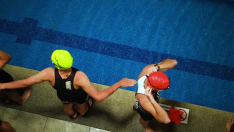 male-swimmers-warming-up-before-the-out-of-pool-swimming-competition