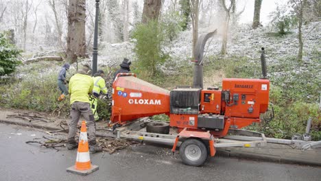 Workers-Using-Woodchipper-Machine-To-Reduce-Woods-Into-Woodchips-Back-To-Nature-At-Winter