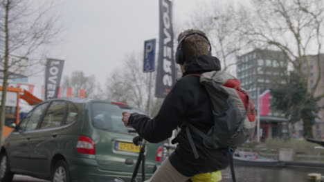 Amsterdam-Male-Riding-a-Bike-Through-the-Streets-during-the-Day-4K-Slow-Motion-RED-Camera