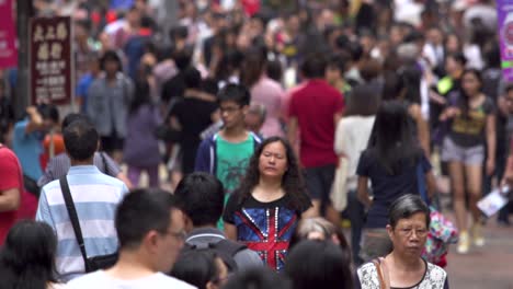 Asiatic-crowded-slow-motion-walking-along-downtown-shopping-main-road