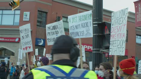 Counter-protesters-signs-close-up-Calgary-protest-4th-March-2022