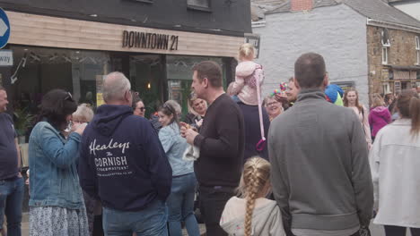 Friendly-People-Talking-While-Eating-Cornish-Pasty-On-The-Street-During-Trevithick-Day-In-Camborne,-medium-shot