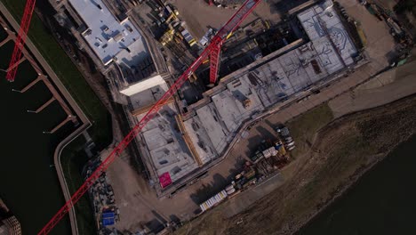 Descending-top-down-and-backwards-aerial-reveal-showing-Kade-Zuid-real-estate-project-of-luxury-apartments-in-Noorderhaven-neighbourhood