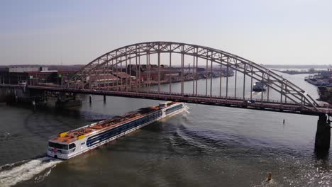 Aerial-View-Of-Spirit-Of-The-Danube-Cruise-Ship-Passing-Underneath-Brug-Over-De-Noord
