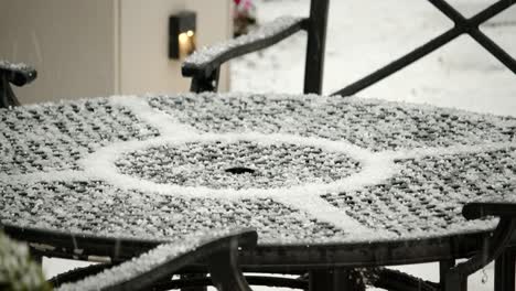 Close-up-Hail-on-a-garden-lounge-table-in-the-UK