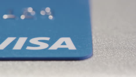 SLIDER-STRAIGHT-SHOT-across-VISA-written-on-a-credit-card