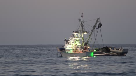 A-commercial-squid-fishing-boat-lighting-up-the-waters-of-Monterey-Bay,-California