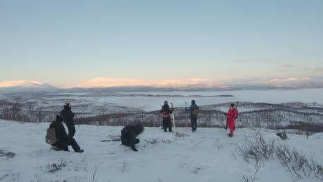 Group-of-people-resting-and-looking-at-the-beautiful-view-of-Swedish-nature