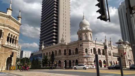 Timelapse-of-Dataran-Merdeka-intersection-with-Museum-Textile-on-the-background-with-blue-sky