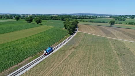 An-Aerial-View-of-Thomas-the-Tank-Engine-Blowing-Smoke-Arriving-by-It's-Self-Rounding-a-Curve-in-the-Track-on-a-Beautiful-Day