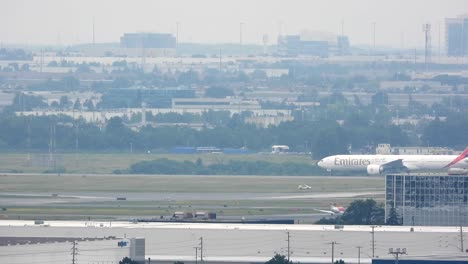 Still-shot-B777-Emirates-airplane-taxiing-on-runway-to-take-off-in-Toronto-International-Airport