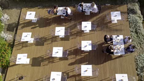 Breakfast-outdoors-with-people-enjoying-eating-and-drinking