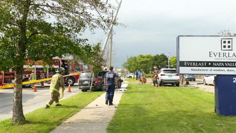 A-black-vehicle-crash-into-a-pole-on-the-sidewalk