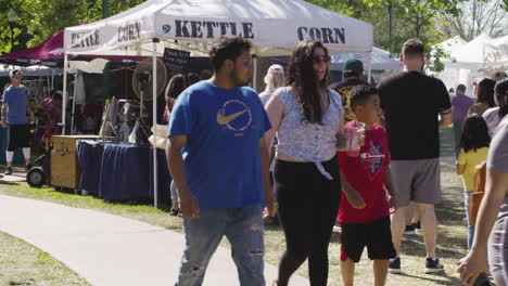 Crowds-queue-at-kettle-corn-food-stall-at-Dogwood-Festival,-Siloam-Springs,-Arkansas