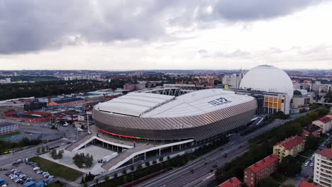 Stockholm-cityscape-and-massive-Tele2-arena,-aerial-orbit-view