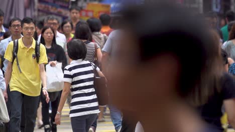 Slow-motion-of-busy-shopping-street-in-downtown-city-center-during-rush-hour