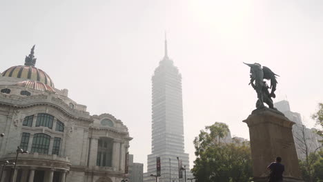 A-tourist-takes-photograph-of-the-Palace-of-fine-arts,-Palacio-de-Bellas-Arts-in-Mexico-City