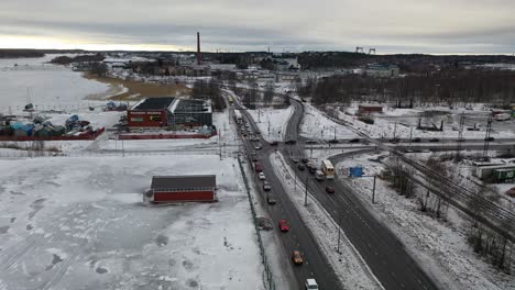 Aerial-view-of-cars-driving-slowly-in-city-center-with-flashing-lights-and-horns-blazing-protesting-against-high-fuel-prizes-at-gas-stations