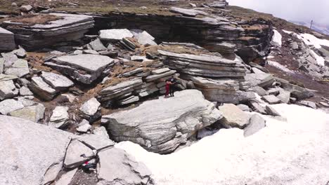 Aerial-shot-of-couple-dancing-above-the-big-rock