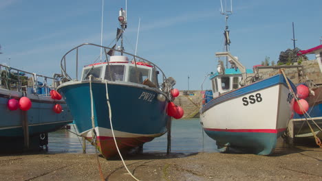 Docked-Cornish-Fishing-Boats-In-Newquay-Harbour,-Cornwall,-England,-UK,-Zoom-out-from-Closeup