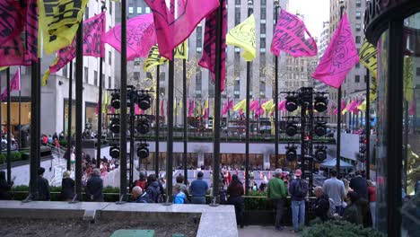 Rockefeller-Centre-flags-at-Flipper’s-spring-roller-skating-rink,-New-York-City