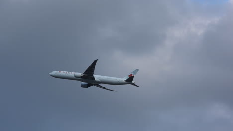 Following-shot-of-a-Boeing-777-from-Air-Canada-taking-off-from-Toronto-Airport,-Canada