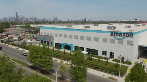 Cinematic-Establishing-Shot-of-Amazon-Warehouse-with-Chicago-Skyscrapers-in-Background