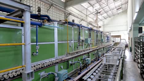 Asian-Workers-Working-in-Ceramic-Factory,-Wide-Shot