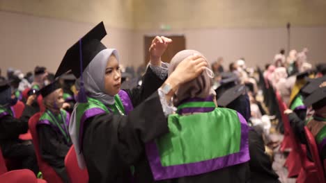 Preparation-for-college-graduates-to-tidy-up-each-other's-friends-to-attend-the-graduation-ceremony