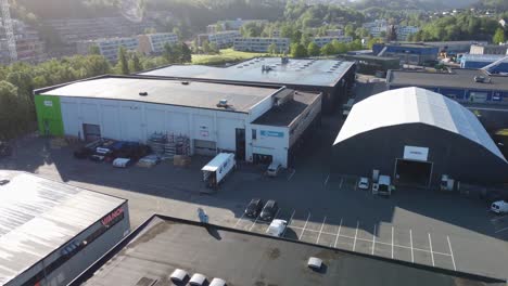 Industrial-area-with-construction-materials-company-Lindab-and-Vianor---Aerial-closeup-with-company-logo-in-Asane-Bergen-Norway