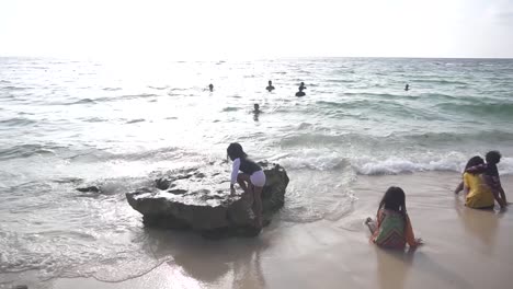 Cinematic-shot-of-kids-playing-at-the-shore