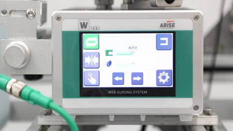 Digital-controls-displayed-on-screen---Fabric-leveler-machine-making-surgical-masks