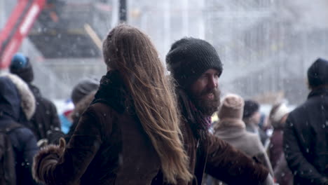 Closeup-shot-of-a-couple-of-people-dancing-among-a-crowd-of-people,-Helsinki-demonstration