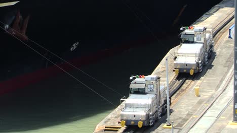 Two-locomotives-towing-the-ship-in-tandem-through-the-Pedro-Miguel-lock