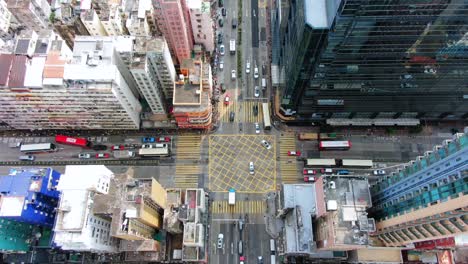 Downtown-Hong-Kong-buildings,-Crosswalk-and-traffic,-High-altitude-aerial-view