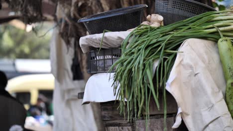 Stack-Of-Greens-Beside-Plastic-Bowls-At-Saddar-Bazaar-Market