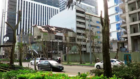 In-the-aftermath-of-typhoon-Odette-,-a-few-cleared-streets-that-became-passable-would-show-denuded-trees-and-much-architectural-damage-on-buildings