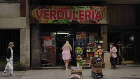 People-with-face-masks-buying-vegetables-in-grocery-store,-Buenos-Aires