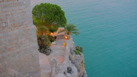 Tourists-Exploring-The-Medieval-Peniscola-Castle-In-Castellon,-Spain---handheld-shot